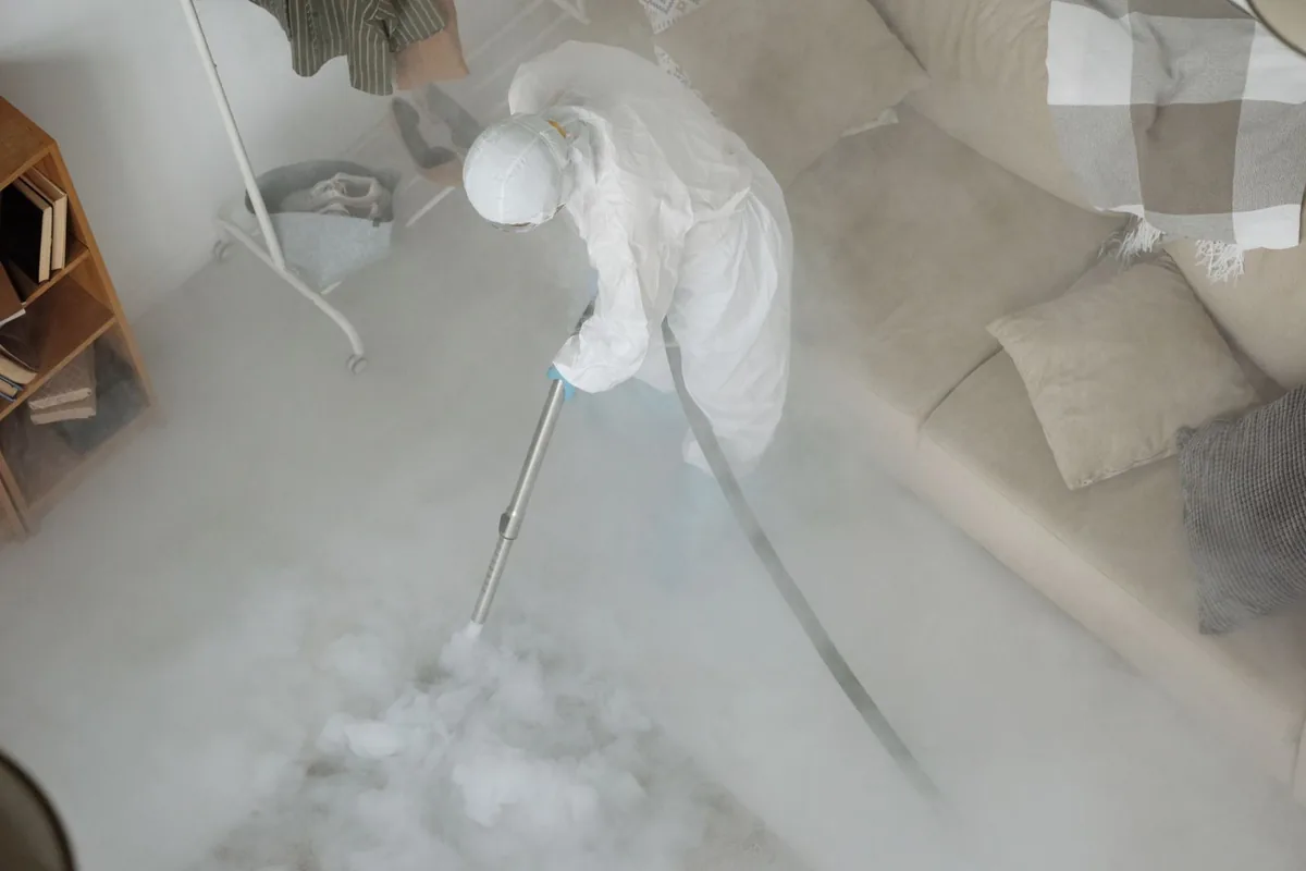 Biohazard cleanup technician in protective equipment, Bristol, FL